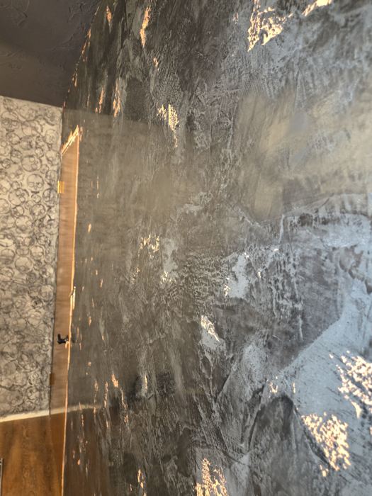 Charcoal Venetian plaster wall with copper leaf