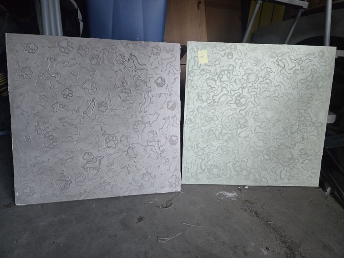 Two stamped relief plaster sample panels